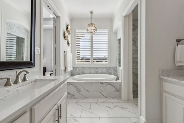 full bathroom featuring vanity, crown molding, a garden tub, and marble finish floor