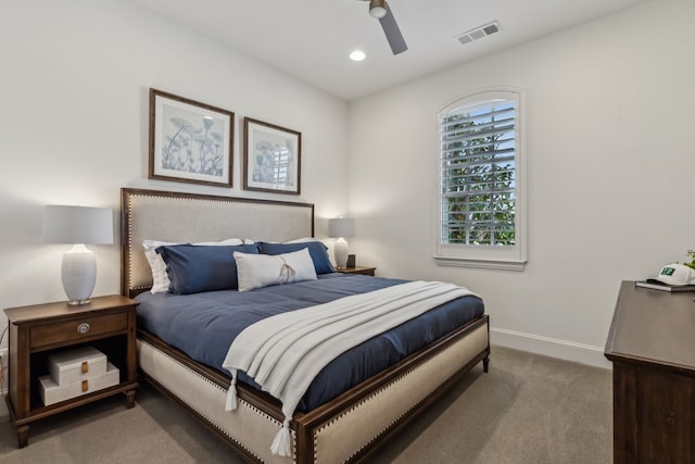 carpeted bedroom featuring recessed lighting, visible vents, baseboards, and a ceiling fan