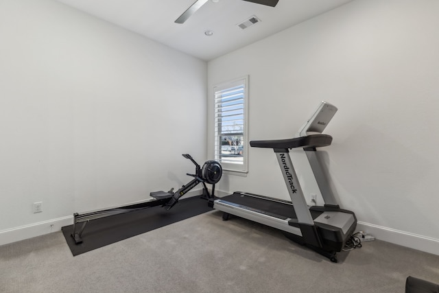 workout area featuring visible vents, baseboards, carpet, and ceiling fan