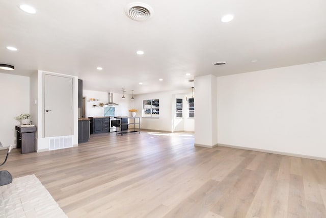 2016 China, Brady, TX 76825 - unfurnished living room with light wood-type flooring, visible vents, baseboards, and recessed lighting