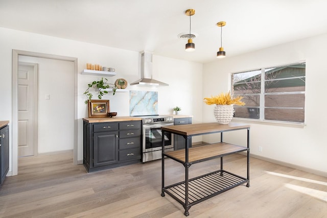 kitchen with visible vents, wall chimney range hood, stainless steel electric stove, light wood-type flooring, and open shelves