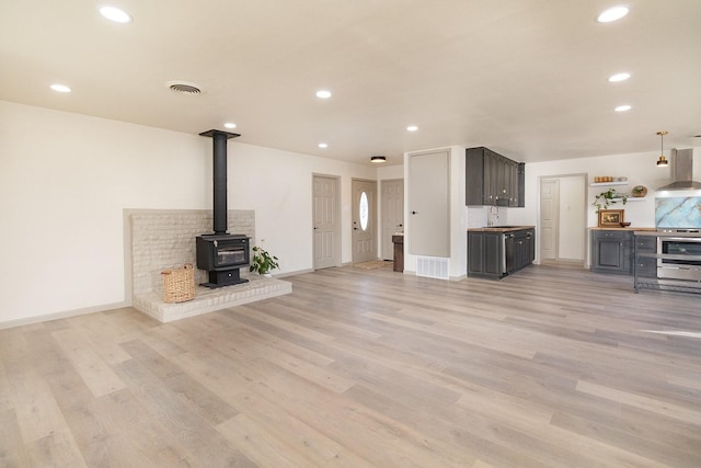 2016 China, Brady, TX 76825 - unfurnished living room with recessed lighting, light wood-style floors, and visible vents
