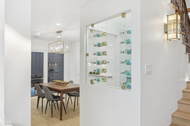 interior space featuring recessed lighting, stairway, an inviting chandelier, and visible vents