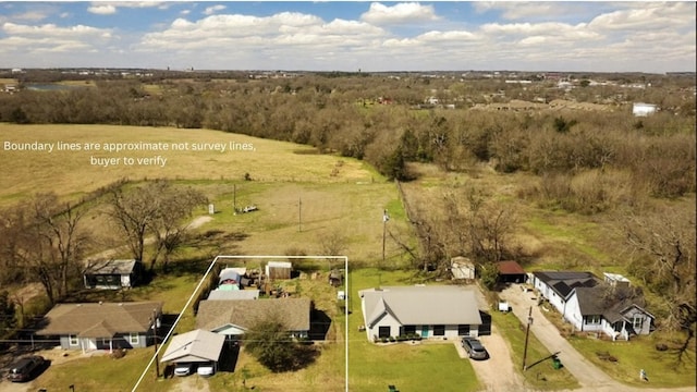 birds eye view of property with a rural view