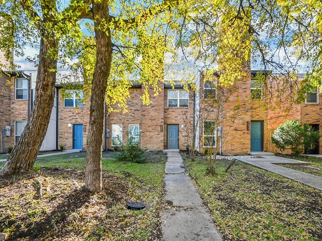 multi unit property featuring brick siding