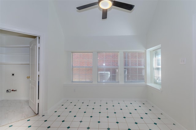 interior space featuring baseboards, lofted ceiling, and ceiling fan