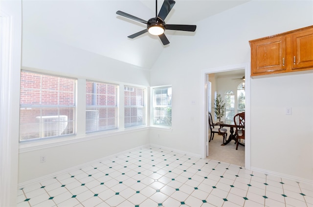 interior space featuring plenty of natural light, lofted ceiling, and a ceiling fan