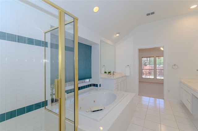 full bathroom with tile patterned floors, a shower stall, vanity, and lofted ceiling