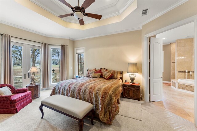 bedroom featuring a raised ceiling, access to exterior, and ornamental molding