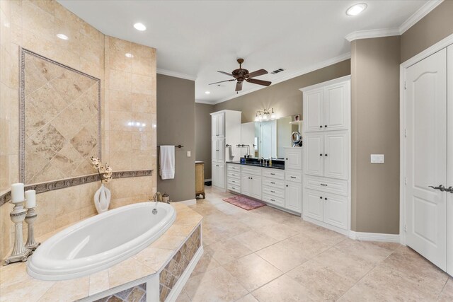 bathroom with ceiling fan, ornamental molding, recessed lighting, a bath, and vanity