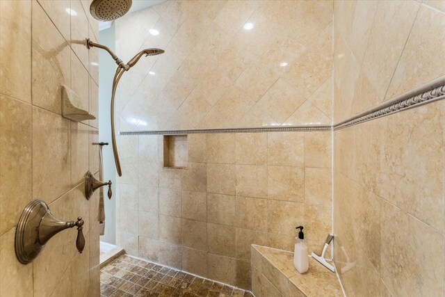 full bathroom with a tile shower