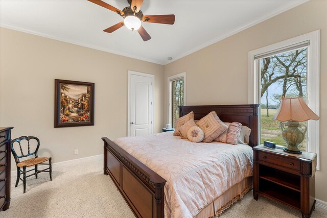 bedroom featuring light colored carpet, ornamental molding, baseboards, and multiple windows