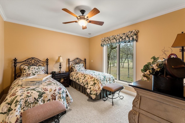 carpeted bedroom with a ceiling fan and crown molding