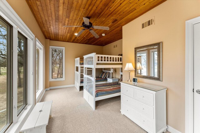 bedroom featuring visible vents, baseboards, carpet, and wood ceiling