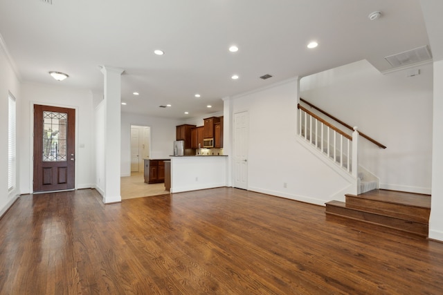 unfurnished living room with recessed lighting, crown molding, stairs, and dark wood-style flooring