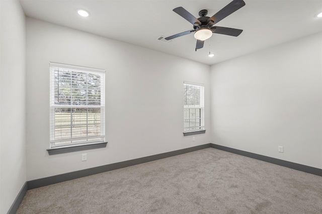 unfurnished room featuring a ceiling fan, visible vents, baseboards, recessed lighting, and carpet flooring