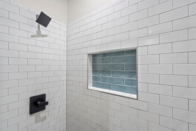 full bath featuring tiled shower