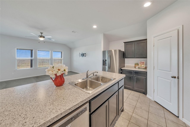 kitchen with light tile patterned flooring, recessed lighting, a sink, stainless steel appliances, and light countertops