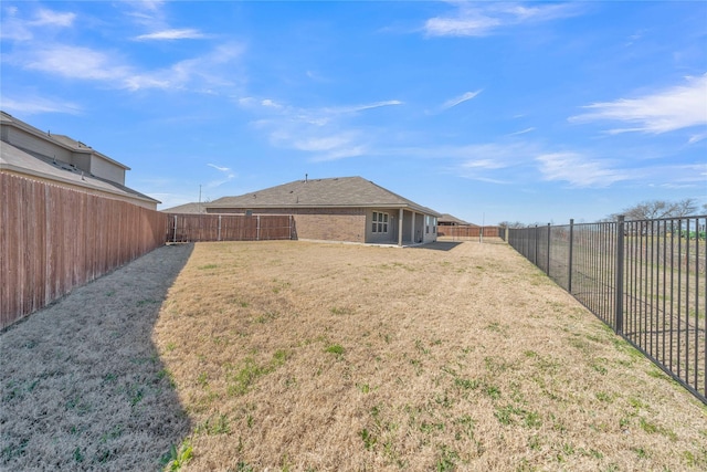 view of yard featuring a fenced backyard