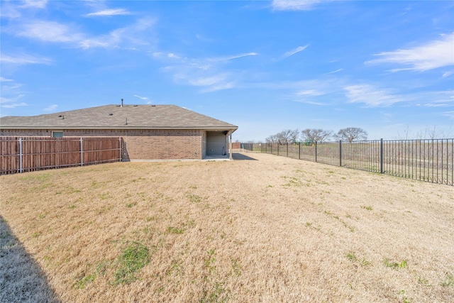 view of yard with a fenced backyard