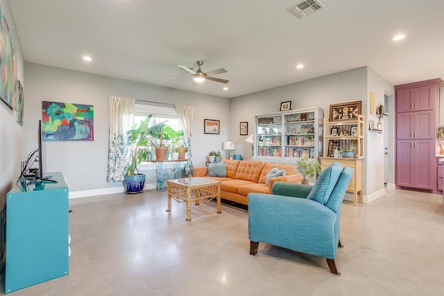 living room with visible vents, recessed lighting, and finished concrete floors