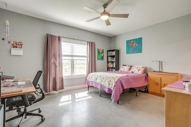bedroom featuring a ceiling fan and finished concrete flooring