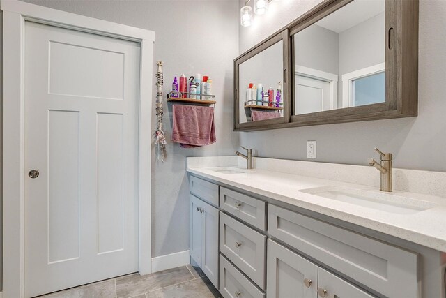 bathroom with double vanity and a sink