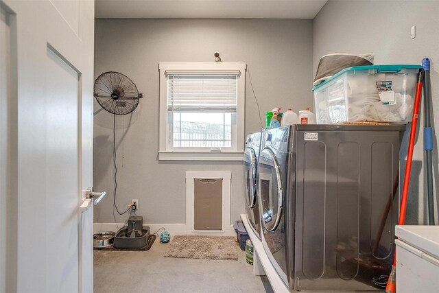 washroom featuring washer and dryer and laundry area