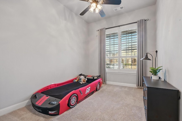 bedroom with light colored carpet, visible vents, and baseboards