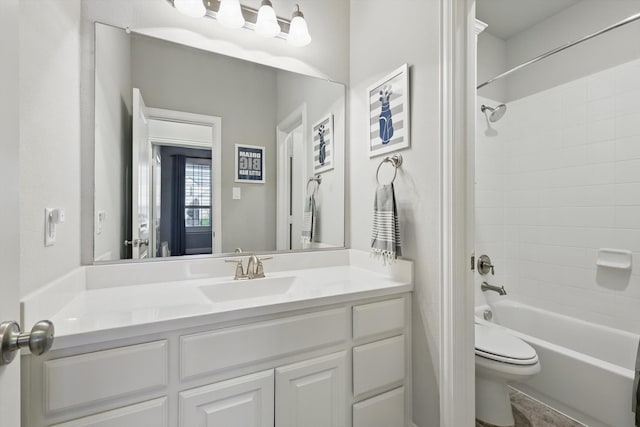 bathroom with shower / bath combination, toilet, and vanity