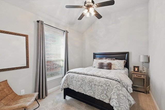 bedroom with baseboards, light carpet, ceiling fan, and vaulted ceiling