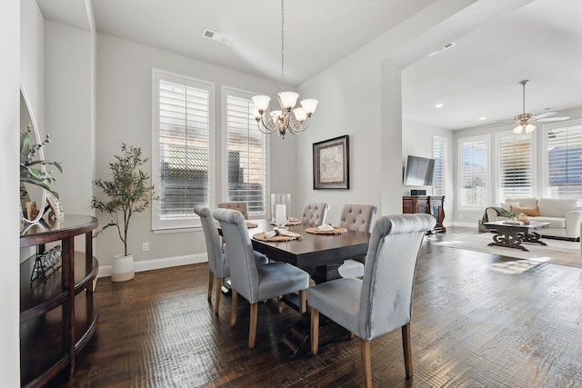 dining room with visible vents, ceiling fan with notable chandelier, baseboards, and wood finished floors