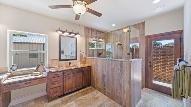 bathroom featuring marble finish floor, a ceiling fan, recessed lighting, walk in shower, and vanity