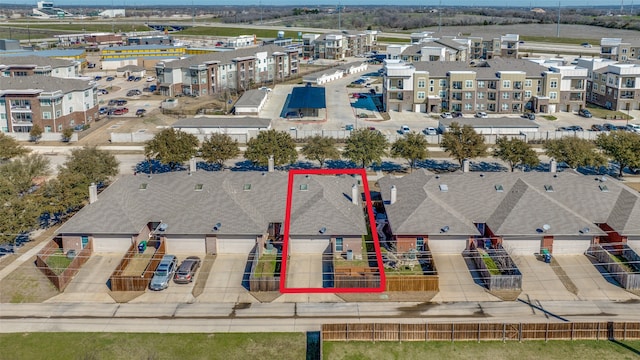 birds eye view of property with a residential view