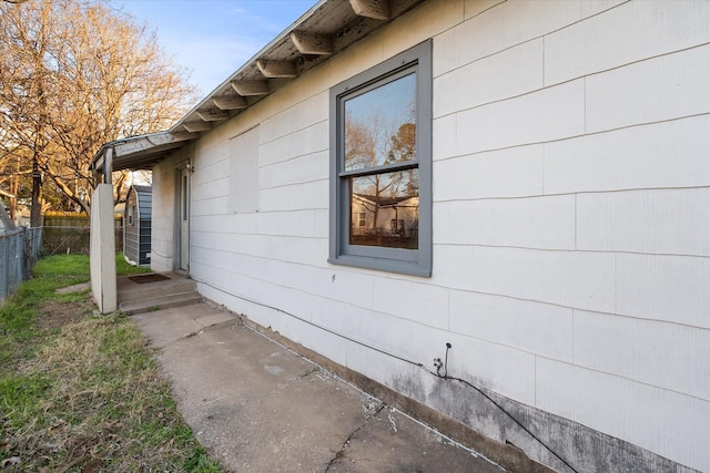 view of home's exterior with fence