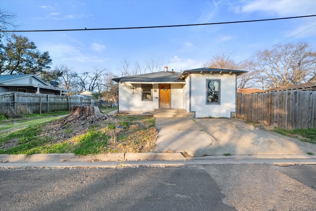 view of front of home with fence