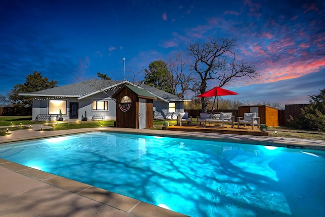 view of pool with a fenced in pool, a deck, and fence