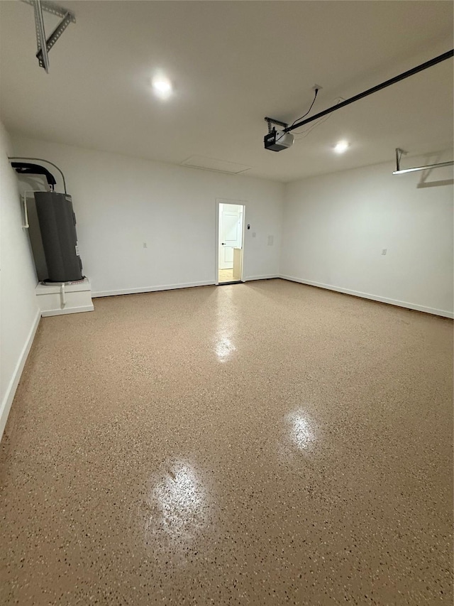 garage with baseboards, a garage door opener, and water heater