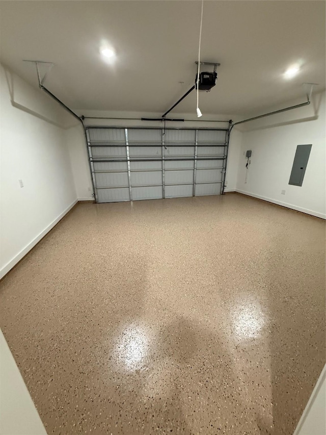 garage with electric panel and a garage door opener