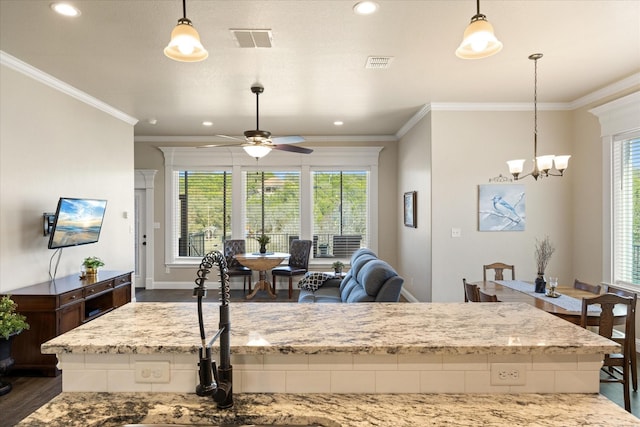 kitchen featuring visible vents, dark wood-type flooring, and crown molding