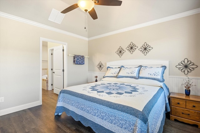 bedroom with wood finished floors, visible vents, ceiling fan, wainscoting, and crown molding