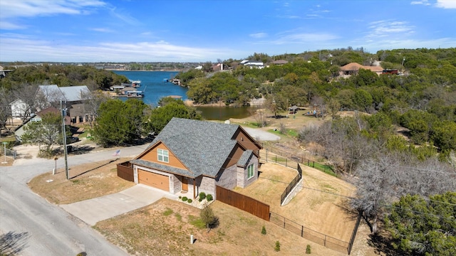 birds eye view of property featuring a water view