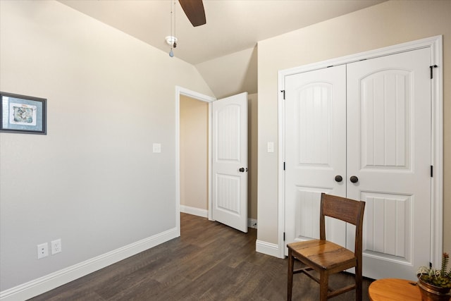 sitting room featuring baseboards, a ceiling fan, and dark wood-style flooring