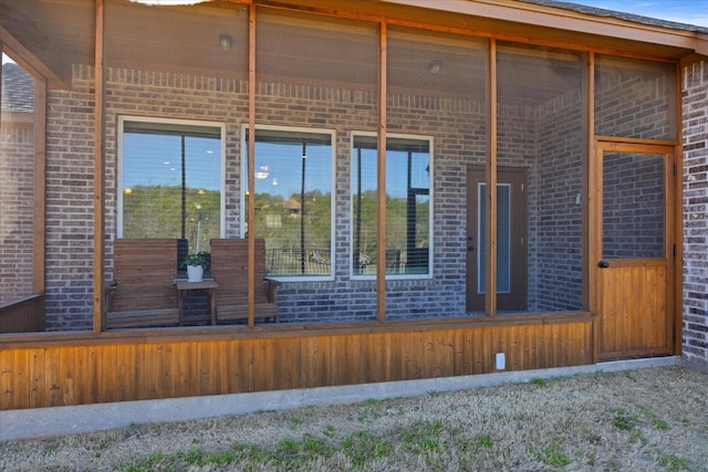 view of side of home featuring brick siding