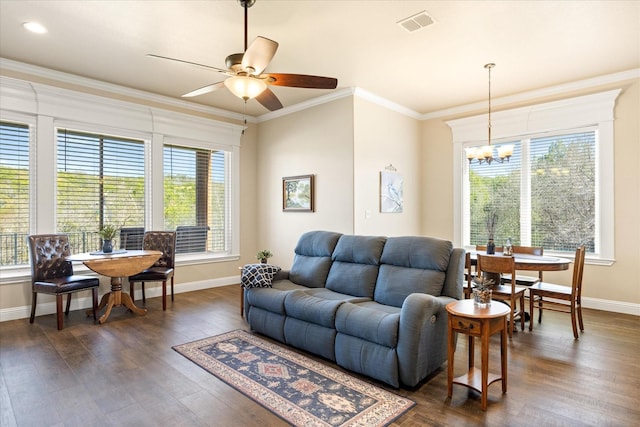 living room featuring plenty of natural light, ornamental molding, and dark wood-style flooring