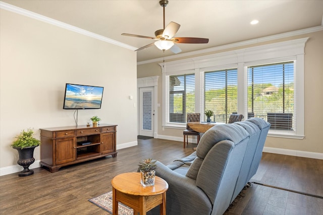 living room featuring a wealth of natural light, ornamental molding, and dark wood-style flooring