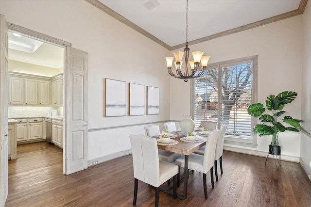 dining space with baseboards, dark wood finished floors, and crown molding