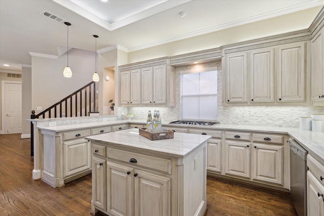 kitchen with visible vents, appliances with stainless steel finishes, a peninsula, and dark wood finished floors