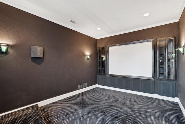 carpeted cinema featuring visible vents, recessed lighting, crown molding, and baseboards