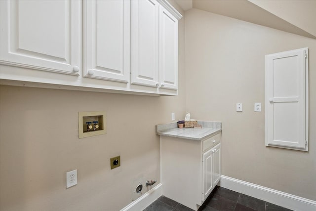 clothes washing area featuring hookup for a washing machine, baseboards, gas dryer hookup, cabinet space, and electric dryer hookup